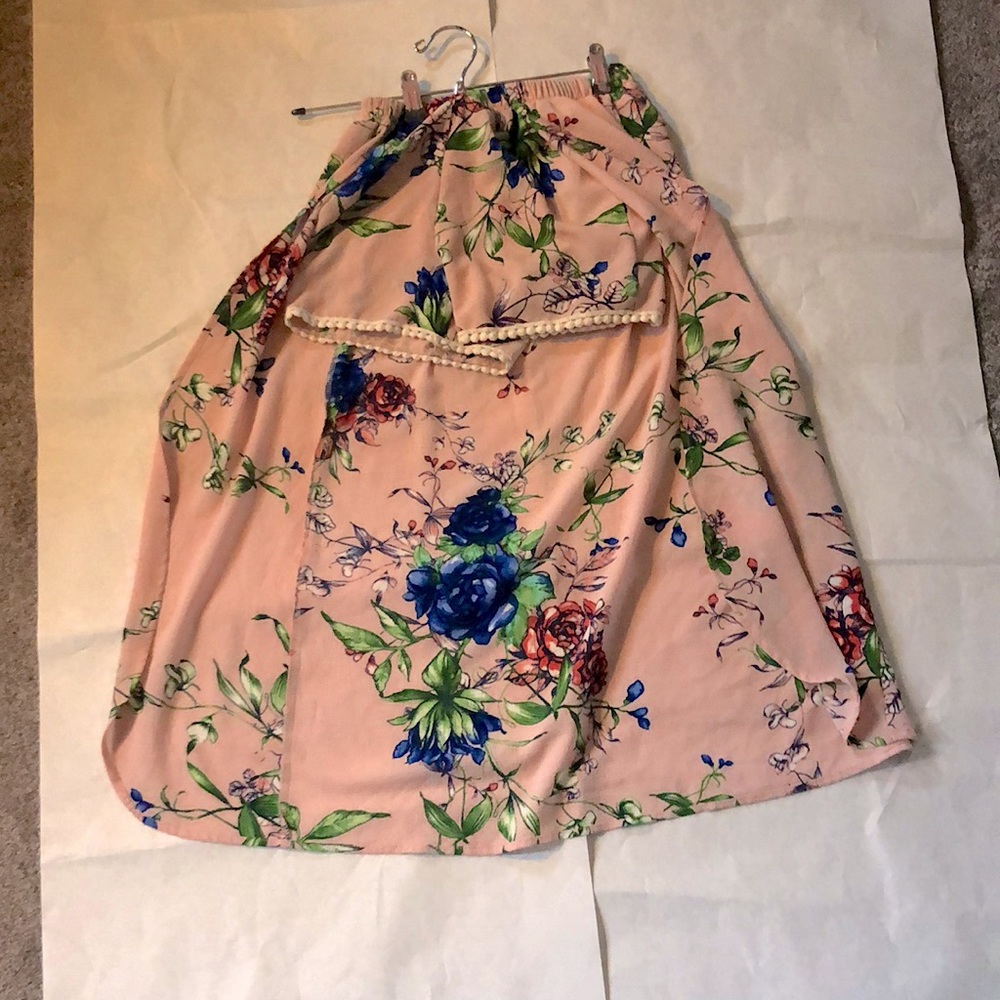 It’s a floral blush pink short /skirt.